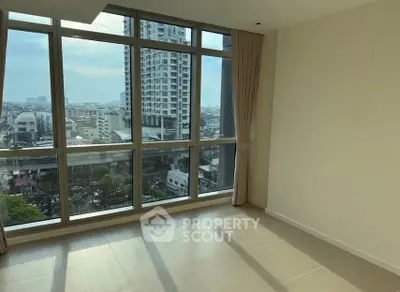 Spacious corner unit with floor-to-ceiling windows offering a stunning city view.
