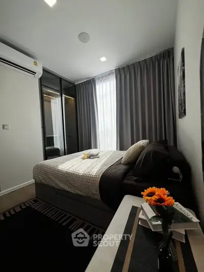 Cozy modern bedroom with stylish decor and natural light