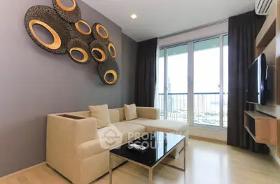 Modern living room with stylish decor and large windows offering a stunning city view.