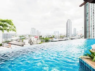 Stunning rooftop infinity pool with breathtaking city skyline views.