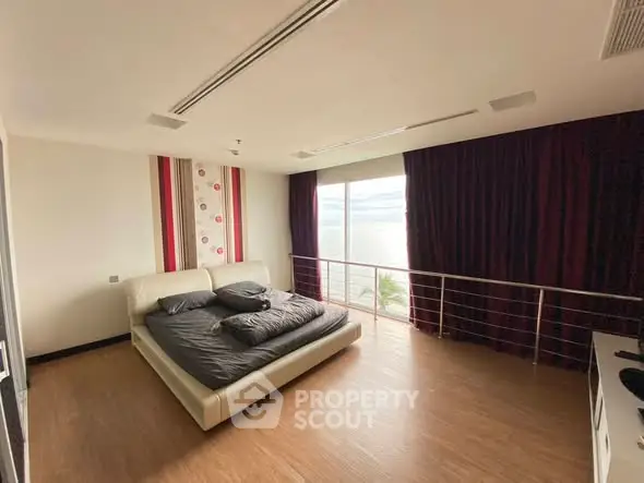 Luxurious bedroom with stunning ocean view and elegant decor