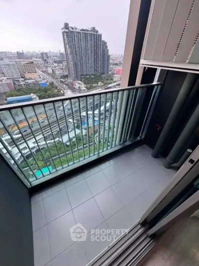 Modern balcony with cityscape view from high-rise apartment