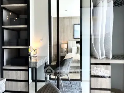 Stylish modern bedroom with elegant decor and built-in storage solutions.