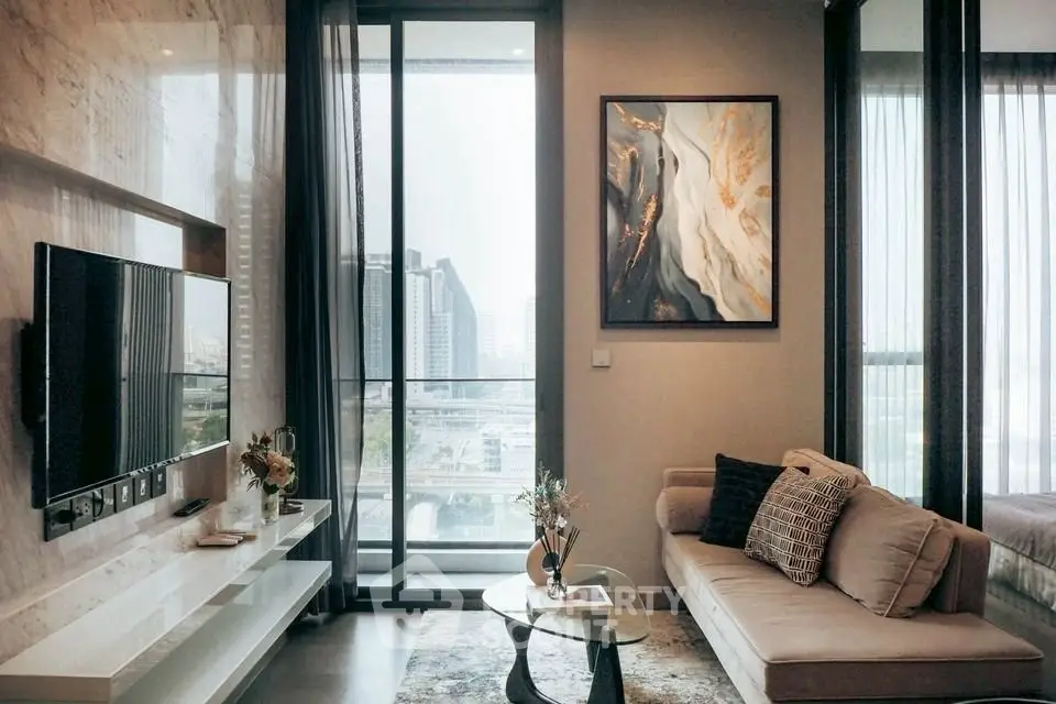 Modern living room with city view, elegant decor, and cozy seating area.