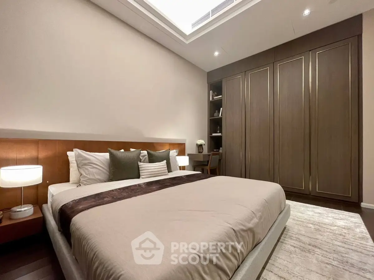Luxurious bedroom with elegant design and spacious wardrobe, perfect for comfort and style.