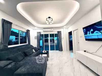 Modern living room with stylish lighting and large sectional sofa
