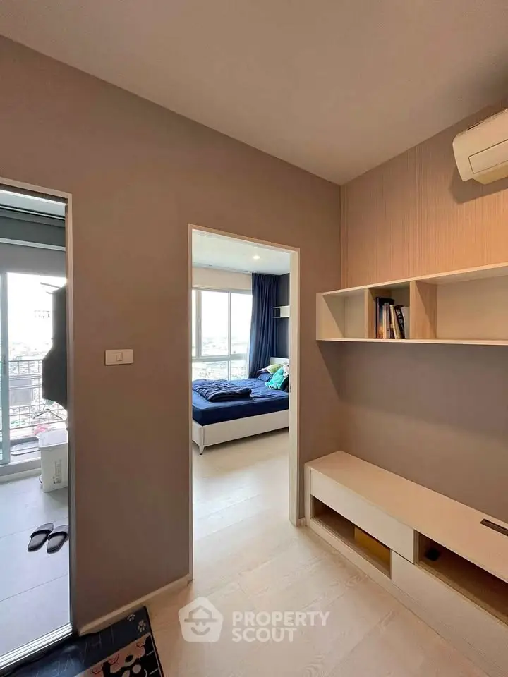 Modern apartment interior with cozy bedroom and stylish storage solutions.