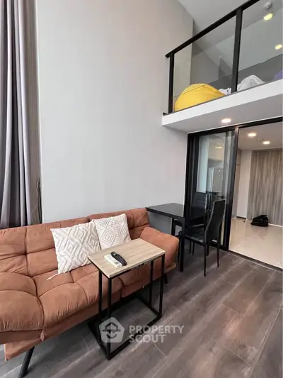 Modern loft apartment with stylish living area and mezzanine bedroom.