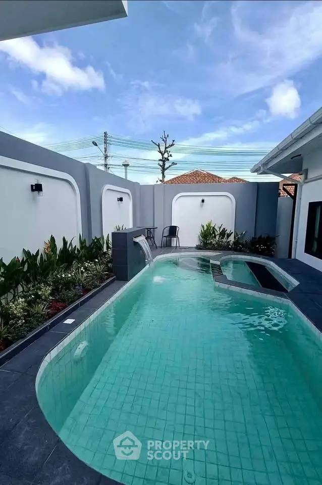 Luxurious private pool with modern design and serene garden setting