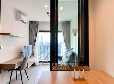 Modern apartment interior with city view, featuring stylish furniture and natural light.