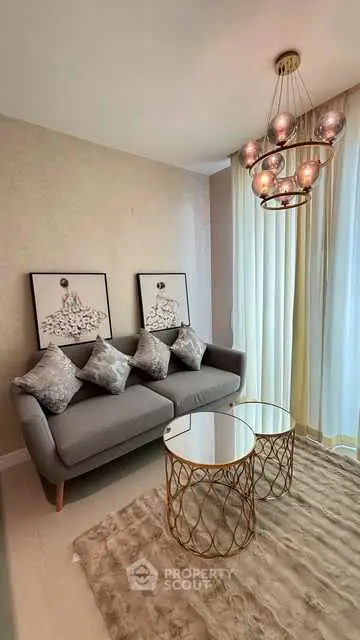 Stylish living room with modern chandelier and elegant decor