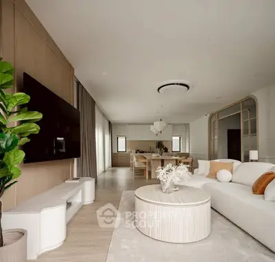 Modern open-plan living room with stylish decor and large TV, perfect for entertaining.