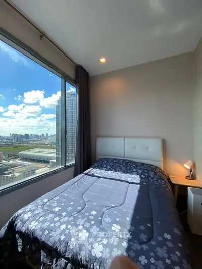 Cozy bedroom with stunning city view and ample natural light