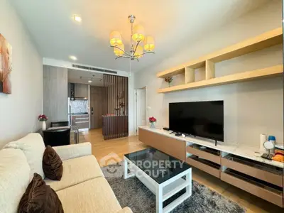 Modern living room with stylish decor and open kitchen layout