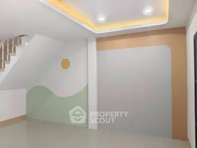 Modern interior with artistic wall design and recessed lighting in a spacious room.