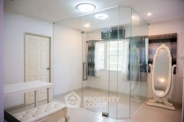 Modern room with glass enclosure and elegant mirror