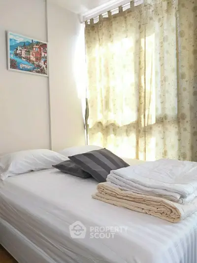 Bright and cozy bedroom with elegant curtains and wall art