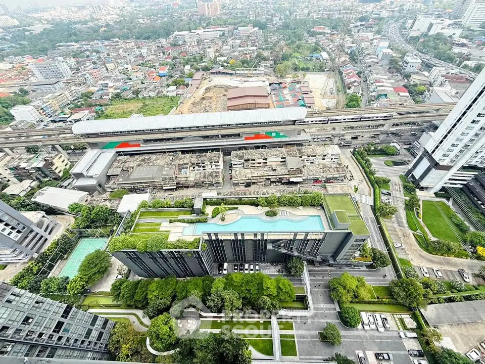 Stunning aerial view of modern urban landscape with lush green rooftops and city skyline.