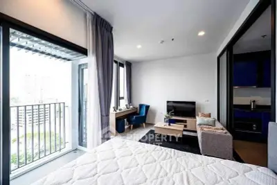Modern studio apartment with balcony and stylish interior design