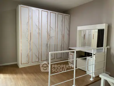 Elegant bedroom with modern wardrobe and stylish vanity area