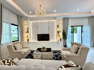 Luxurious living room with elegant chandelier and plush seating