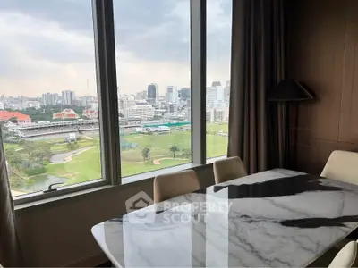 Luxurious dining area with stunning cityscape and golf course view from high-rise apartment.
