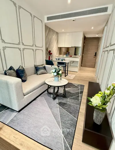 Modern living room with stylish decor and open kitchen layout