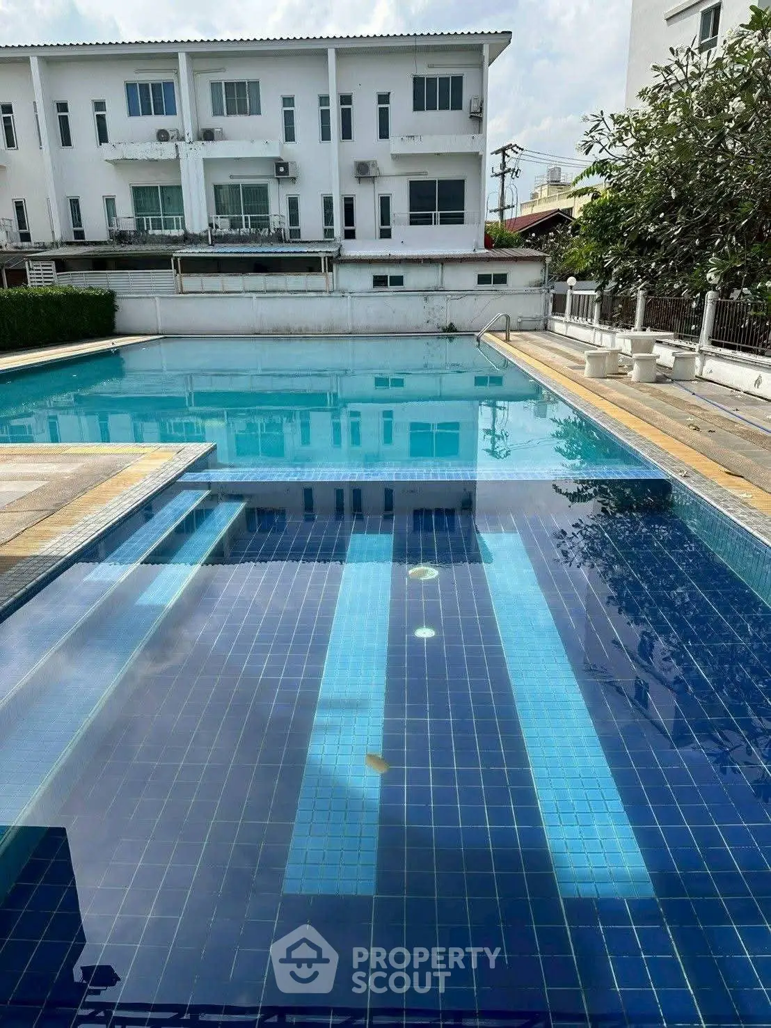 Luxurious residential pool area with modern design and serene ambiance, perfect for relaxation and leisure.