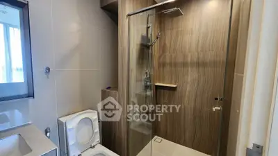 Modern bathroom with sleek shower and elegant wood paneling