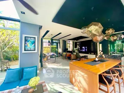 Luxurious open-plan living room with modern decor and abundant natural light