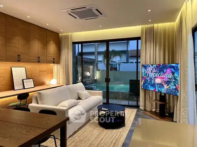 Luxurious living room with pool view, modern decor, and elegant lighting