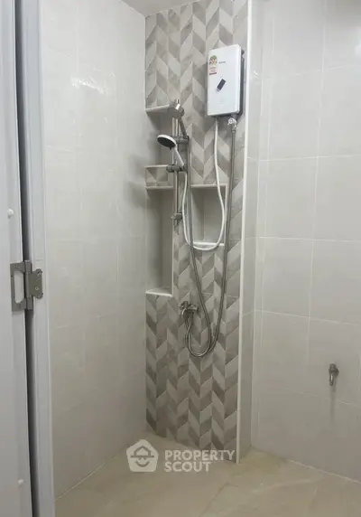 Modern bathroom with stylish shower and neutral tiles