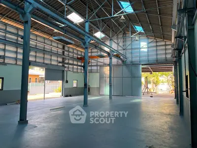 Spacious industrial warehouse with high ceilings and ample natural light