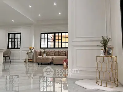 Luxurious living room with elegant decor and plush seating in a modern home.
