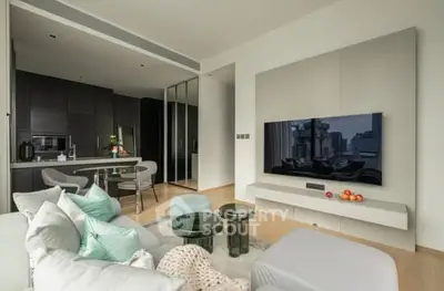 Modern living room with open kitchen and sleek decor