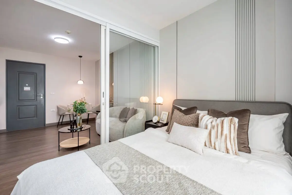 Modern bedroom with stylish decor and mirrored closet doors