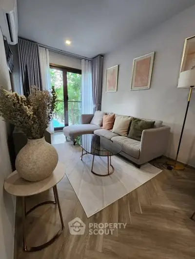 Modern living room with stylish decor and large window view