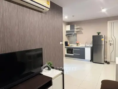 Modern open-layout kitchen with sleek appliances and stylish decor