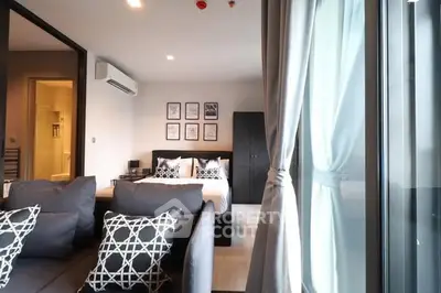 Modern apartment interior with stylish living room and cozy bedroom