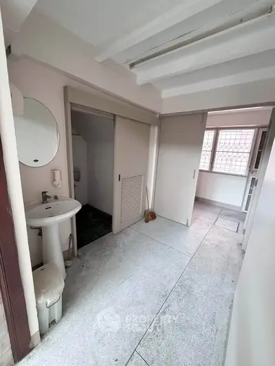 Spacious bathroom with modern fixtures and ample natural light
