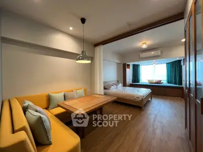 Spacious studio apartment with modern furnishings and natural light