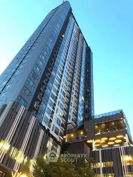 Stunning modern high-rise building with sleek architecture and expansive glass windows.