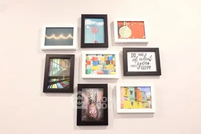 Stylish wall art arrangement in a modern living room interior.