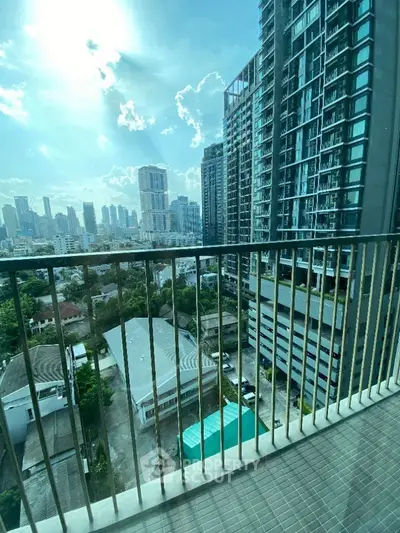 Stunning city view from modern high-rise balcony, perfect for urban living.
