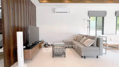 Modern living room with stylish furniture and natural light