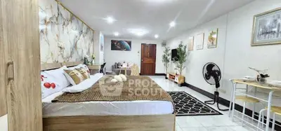 Spacious and stylish bedroom with modern decor and cozy ambiance