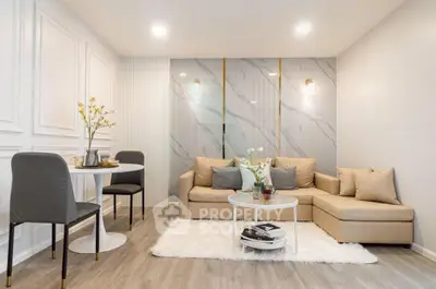 Modern living room with elegant decor, cozy beige sofa, and stylish round coffee table.