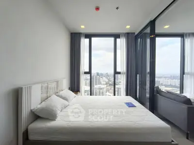 Luxurious bedroom with panoramic city view and modern furnishings
