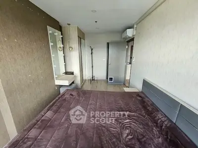 Modern bedroom with stylish decor and ample natural light