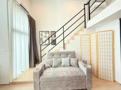 Modern loft-style living room with cozy sofa and stylish decor